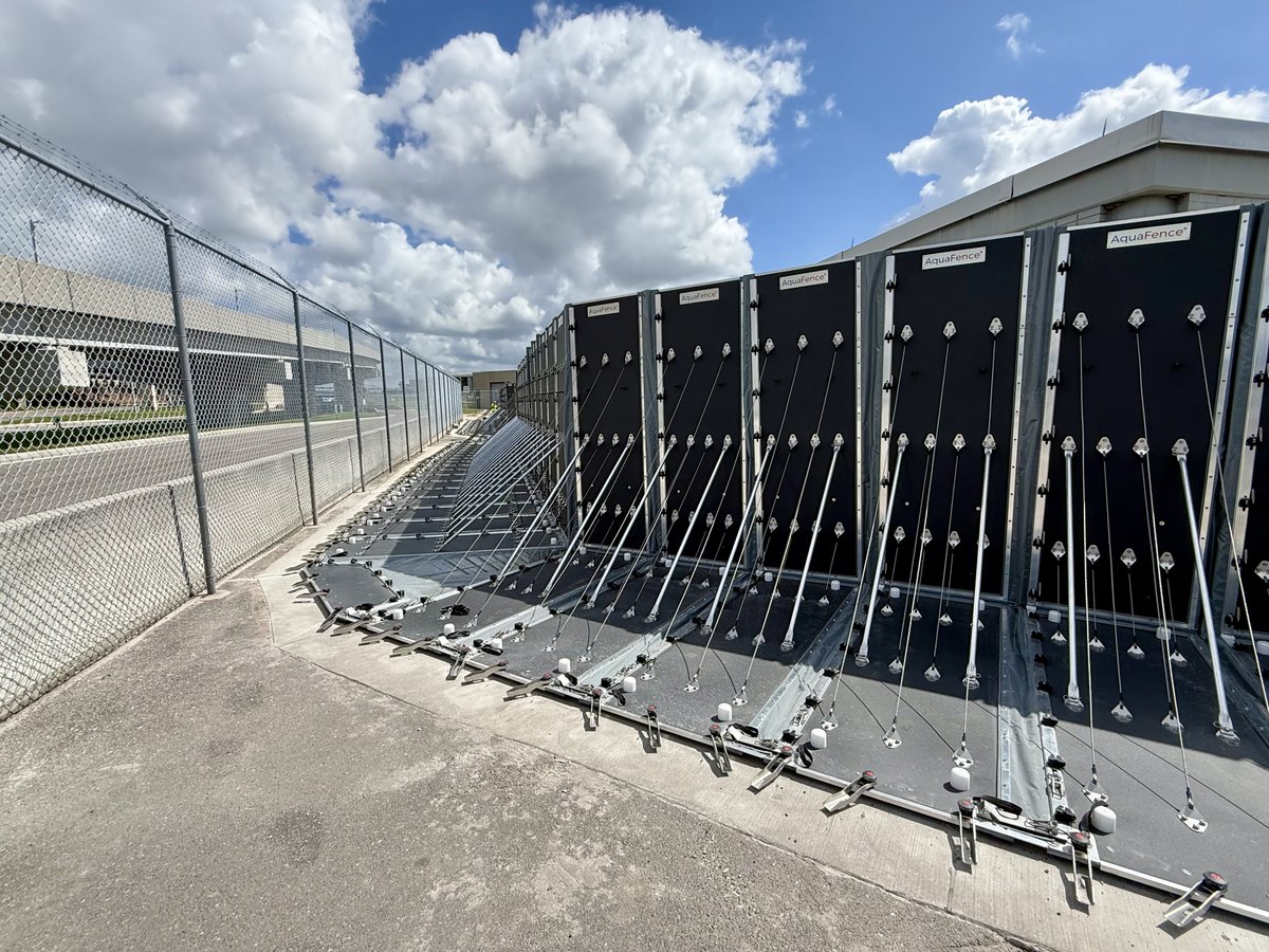 FlyTPA's tweet photo. PREPPING FOR THE FUTURE 🫡 Say hello to our new AquaFence, a temporary 9-foot barrier designed to shield TPA from storms. This new system was recently built to protect two electrical vault buildings should a hurricane threaten Tampa Bay. ⛈️

DETAILS: https://t.co/u5ItGGbGs3 https://t.co/eosbkfIyME