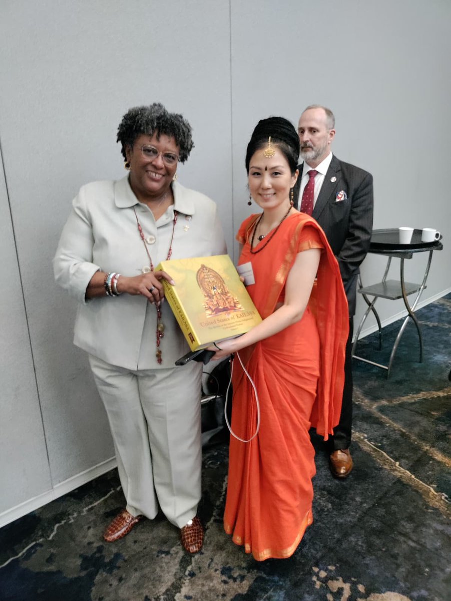 kailasanation's tweet photo. On Sept. 21, 2026, UAN delegates met H.E. Mia Amor Mottley, Prime Minister of Barbados, at UNGA in New York. UAN presented KAILASA’s book and UAN booklet, discussed cooperation, and highlighted its IGO status and Headquarters Agreement with Guinea-Bissau. https://t.co/G1lDcmNSTk