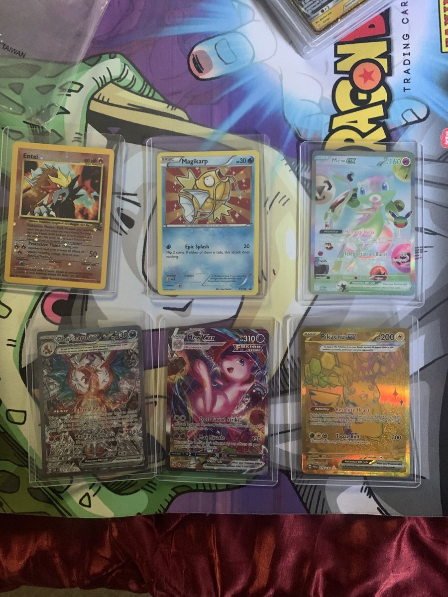 BTCBrandonX's tweet photo. Sending in a new batch to @PSAcard! 
Wish me luck 💫 #Pokemon #FutureMew #Entei #MewVmax #Charizard #Pikachu #Magikarp https://t.co/kcILBQjKFA