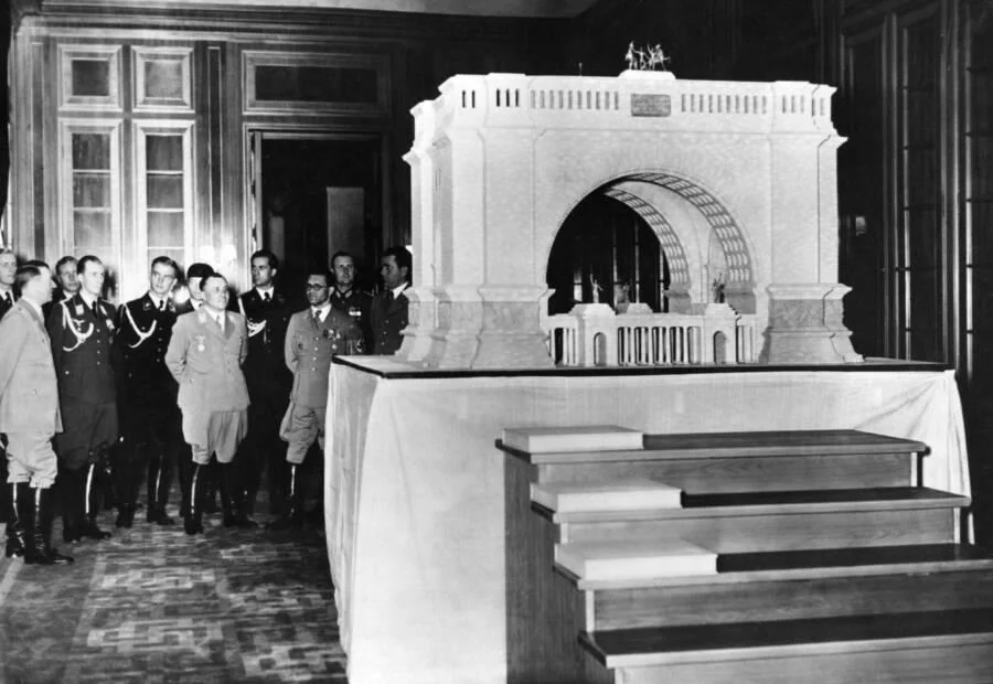 essenviews's tweet photo. Hitler and other top Nazis inspect a scale model of a planned Triumphal Arch in Berlin, circa 1939. https://t.co/BXmuH3qLbz