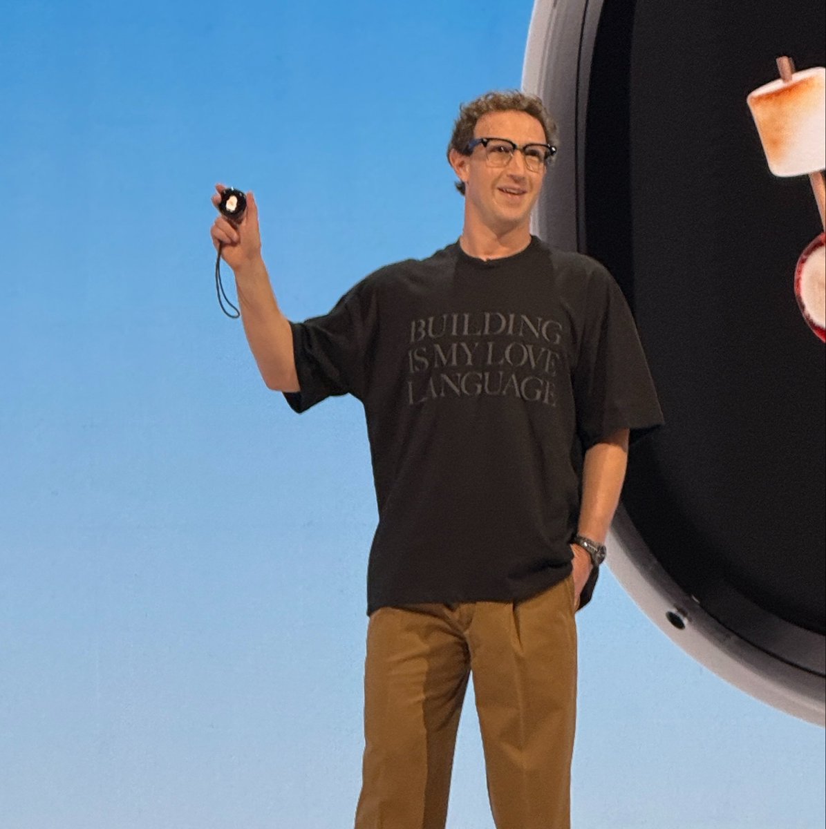 MikeIsaac's tweet photo. mark does a “one more thing” with a new hardware device — AI agent called “Muse Charm” that’s voice activated and palm sized

out in time for the holidays. maybe it’s about to be agentworld….?

(also conspicuously before OpenAI’s mystery hardware device) https://t.co/qOHCpUURdd