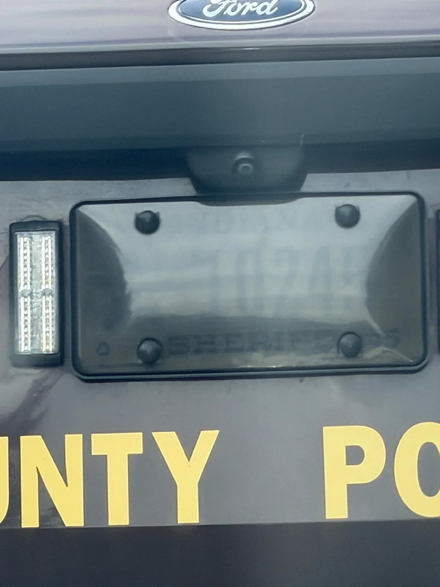 OrwellDay's tweet photo. Indiana Sheriff’s license plate almost entirely hidden by smoked-out plate cover https://t.co/tsoPAhkJbS