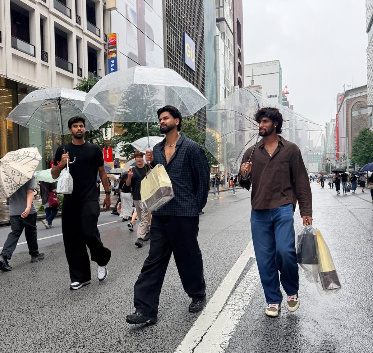 CricCrazyJohns's tweet photo. Captain Shreyas Iyer, Washington Sundar &amp; Tilak Varma enjoying the rain in Japan 🤍 https://t.co/sRRgh2Cn2B