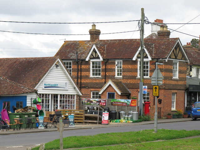 MabelReviewsGB's tweet photo. One loaf showed me how Northiam keeps daily life close

I’ve just stopped in Northiam, East Sussex, for bread, but the useful little cluster on Main Street became the real discovery. A bakery and café sit beside a hardware and garden shop, with plants outside and a bus stop almost at the door.

I nearly walked straight back to the car. Instead, I sat down and noticed how neatly the errands line up. That is what a living village centre should do: let someone buy supper, find a practical tool and catch a bus without making three separate journeys. Places like this deserve protection as everyday infrastructure, not scenery.
