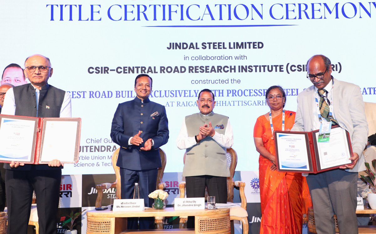 DrJitendraSingh's tweet photo. Addressed the ceremony to hand over the "Guinness World Record Certificate" jointly to Central Road Research Institute (#CSIR-CRRI), New Delhi and Jindal Steel Limited.

Takeaways:
"Steel Slag Road Technology can substantially extend the maintenance cycle, with maintenance of roads required only after about 15 years in suitable applications, making it a breakthrough with implications not only for road engineering but also for the overall infrastructure economy. Most importantly, it reduces road construction cost by around 40 per cent while delivering four times the strength of conventional roads.

Proud to preside over the conferment of the Guinness World Record for the “World’s Longest Road Built with Processed Steel Slag Aggregates”, jointly pursued by CSIR-Central Road Research Institute (CSIR-CRRI) New Delhi and Jindal Steel Limited. The 1.85-km road at Raigarh, Chhattisgarh, marks a major scale-up of an indigenous technology that converts processed steel slag, a by-product of steel production, into aggregates for road construction. Meanwhile, work on a 40 km steel slag road has already started.

A purely indigenous technology now being adopted by other countries as well, beginning from Oman, which lives up to the dictum of "Made in India, Made for the World".   Also, simultaneously lives up to more than one flagship priorities of this government, including PM Sh @narendramodi  ji's repeated emphasis on "Waste to Wealth" recycling options.   

It is time now to move on from one project to many projects and from one State to many States, with its adoption extending beyond the Ministry of Road Transport and Highways to Railways, other Government departments, State Governments and private builders, contractors and infrastructure operators".