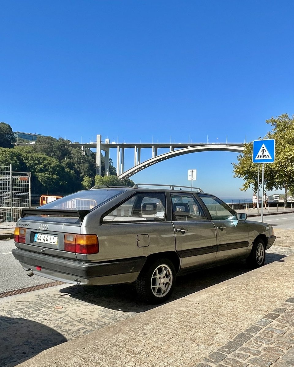 TimPollardCars's tweet photo. Bumped into two exquisite C3 third-generation Audi 100s on my travels recently: this Avant in Porto, with another feat of engineering in the background, and the streamliner saloon in Berlin. Such influential cars 💡 
>> 1 of 4 https://t.co/RNEI98MWuK