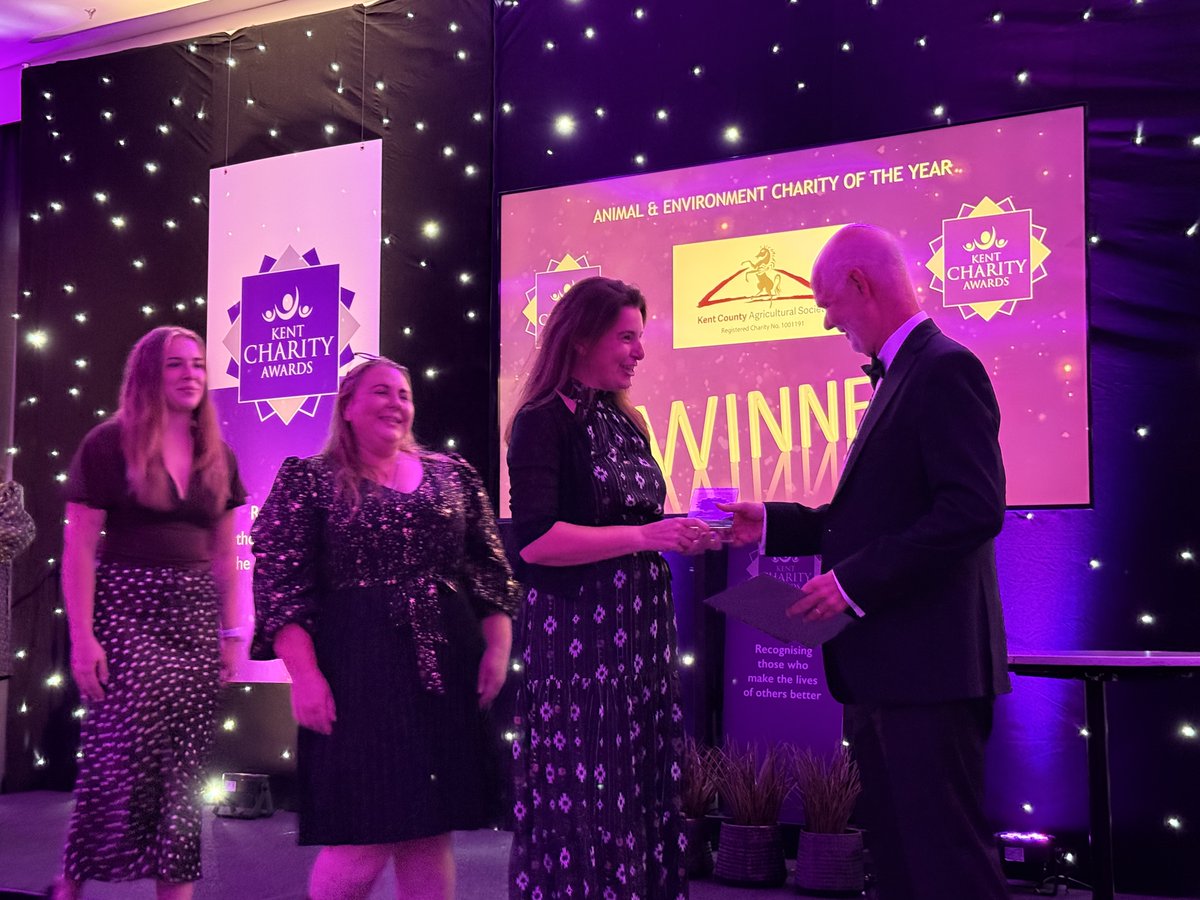 Stuart Jeffery presents an award to the team from Kent County Agricultural Society