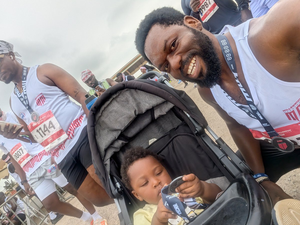 Amegaxi's tweet photo. Today I did the coolest thing I've ever done in my life! 

I run a 5K while pushing my son in a stoller. It was hard pushing uphill but we did it 🔥🔥🔥

He was a bit disappointed because he thought the medal was biscuit but he's made peace with it. https://t.co/xDqEErEjQ8