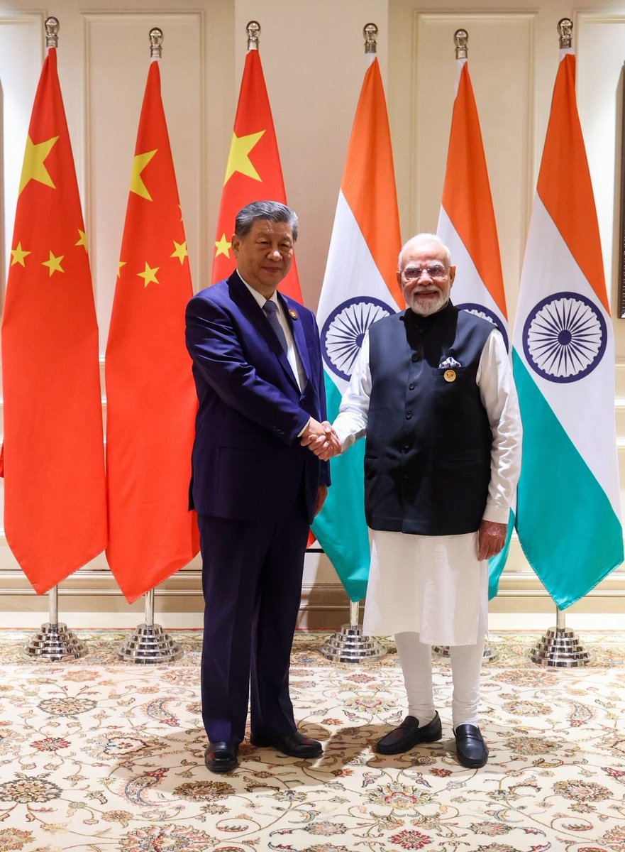 PMOIndia's tweet photo. PM @narendramodi and President Xi Jinping met on the sidelines of the Delhi BRICS Summit today. The two leaders reviewed the full range of India-China relations. https://t.co/qxDhxZZe1k