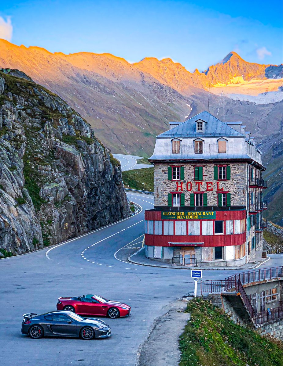 WirthSteven's tweet photo. The iconic Belvedere Hotel on the Furka Pass, one of the great alpine drives, immortalised by Sean Connery in Goldfinger. A Porsche Cayman and Aston Martin Vantage V12S to provide the fun 😃 https://t.co/pxTZvvcWwL
