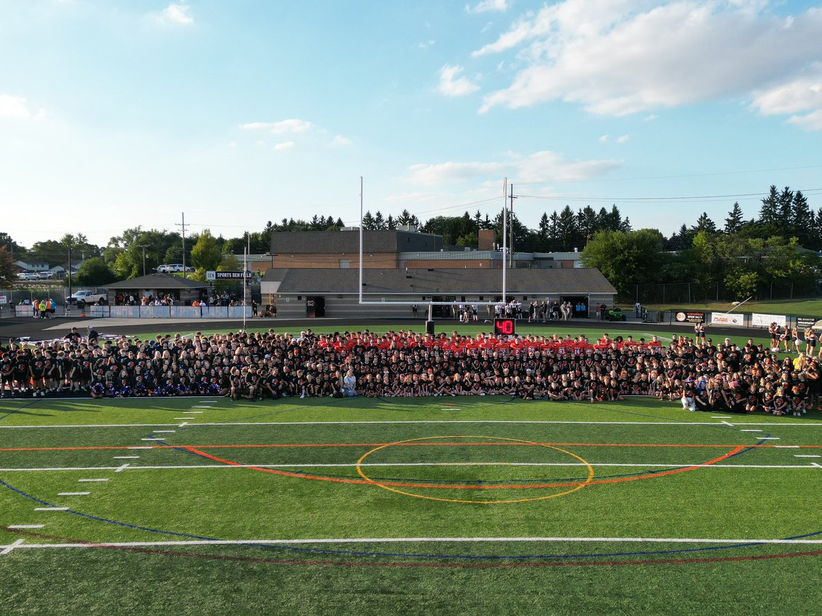 brentluplow's tweet photo. WHAT A NIGHT. This year with the help of our sponsors we purchased 1,000+ t-shirts for all involved in Northville Football + Cheer in 1st-12th grade. It was incredible seeing all the smiling faces and shirts last night! This group photo makes me so proud, the future is BRIGHT! https://t.co/NxgMkRLOuu
