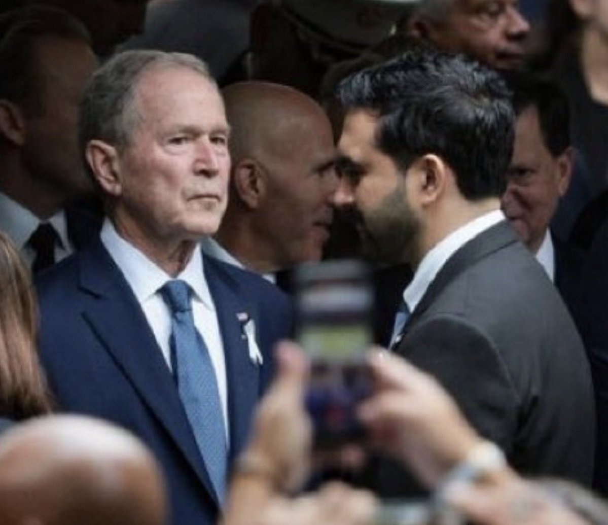 DC_Draino's tweet photo. George Bush glaring at Mamdani after he giggled with AOC at the 9/11 memorial is exactly the anger we all feel about those communist clowns. https://t.co/X5qsx71WfQ
