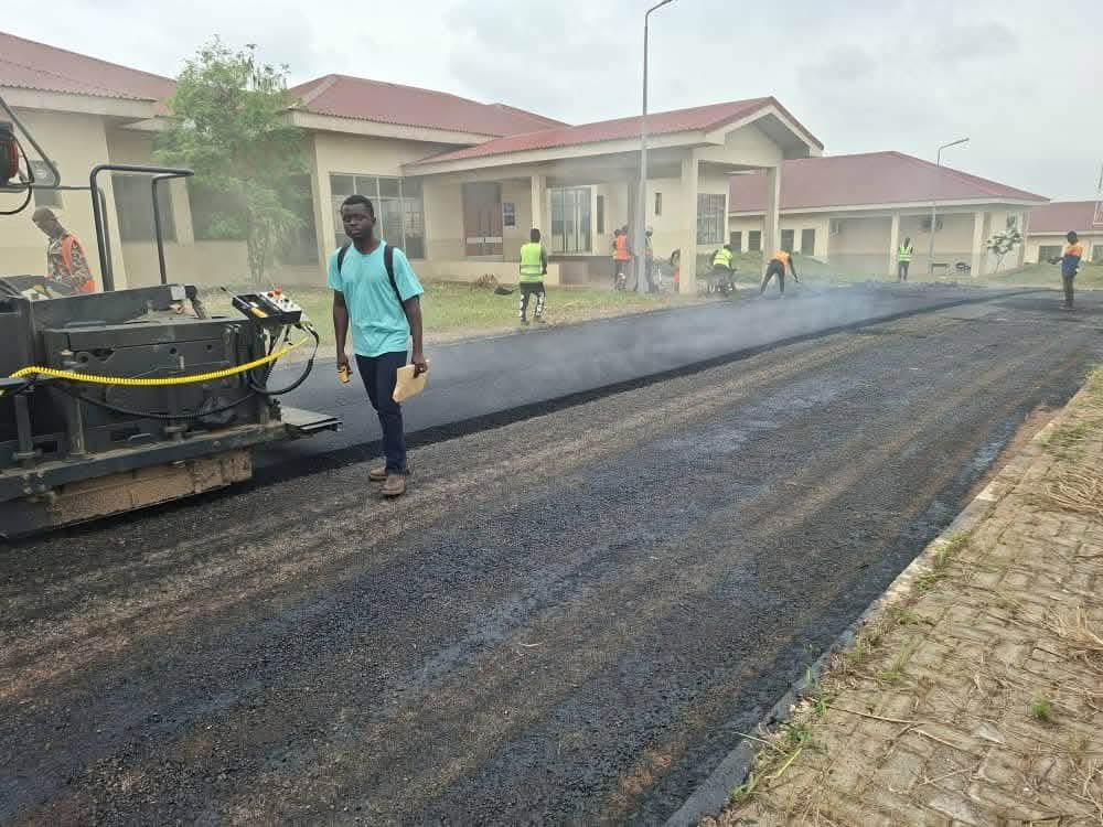 DrAmoakohene's tweet photo. We’re inside the hospital itself. Base works asphalt works ongoing. 
#BigPush #JM #Agbodza 
#KofiJob https://t.co/74NluCqYB7