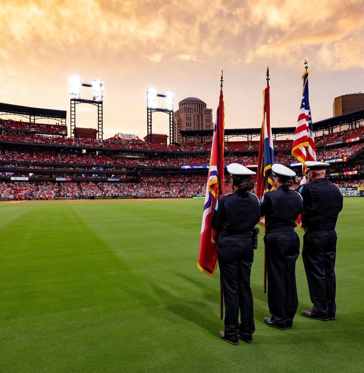 SLMPD's tweet photo. Last night, your #SLMPD Honor Guard proudly stood alongside fellow first responders and our community before the St. Louis @Cardinals game at Busch Stadium as we marked the 25th anniversary of September 11.

It was an honor to be part of a powerful evening of remembrance — honoring the lives lost, the first responders who answered the call and the families forever changed.

We will never forget.