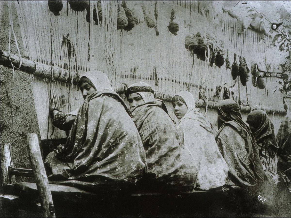 archeohistories's tweet photo. In Iran around 1880, carpet weaving was far more than a domestic craft—it was a deeply embedded cultural tradition and an essential part of many women’s lives. Women, often from childhood, learned the intricate patterns passed down through generations, their hands guided by both memory and intuition. Working on looms set up in courtyards, small rooms, or dedicated village workshops, they created carpets that told stories—of place, of identity, of quiet artistry woven knot by knot.

These weavers weren’t always visible in official histories or trade records, yet their labor fueled an international industry. Persian carpets were prized across Europe and beyond, admired for their beauty and craftsmanship, yet the women behind them often worked under difficult conditions. Many came from rural or tribal communities, where weaving was both an economic necessity and a communal act—done alongside sisters, mothers, daughters.

The work was demanding: hours hunched over looms, eyes straining to read complex, often improvised designs that required mathematical precision and a deeply intuitive sense of color and rhythm. Each carpet could take months or even years to complete, depending on its size and complexity.

Though they rarely signed their names to their work, these women left lasting signatures—through pattern, through skill, through the quiet endurance woven into every thread. Their carpets carried not just beauty, but legacy: a textile history authored by women whose artistry was often anonymous but never invisible.

#archaeohistories