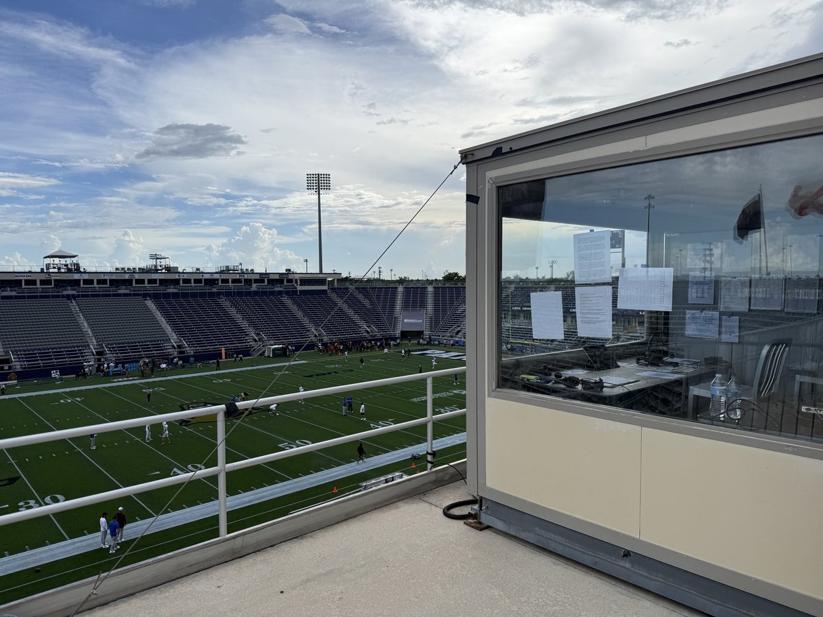 PeckOnSports's tweet photo. In 27 years of calling @UBuffaloFB, this visiting radio setup at FIU is one of the most unique. Radio booth(s) are a standalone prefab building at top of stands. Plus, we have to share it with Panthers radio. Same room. Divider in between. They’ll definitely hear us! https://t.co/c1HU7vpI6O