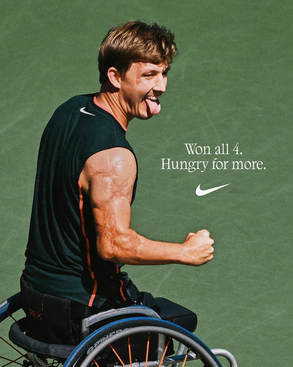 Niels Vink celebrates a point in New York in a wheelchair, tongue out, wearing a black Nike tennis kit. Headline "Won all 4. Hungry for more." and the Nike logo.