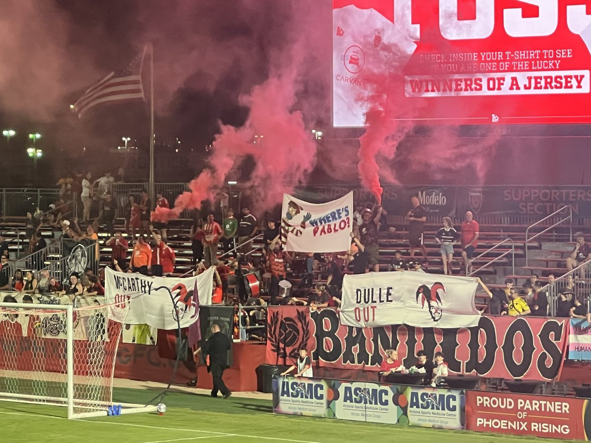 ojevans18's tweet photo. New South End banner taking aim at Phoenix Rising principal owner Pablo Prichard.

The banners against Bobby Dulle and Brandon McCarthy also returned. https://t.co/hK7jmRO5XM