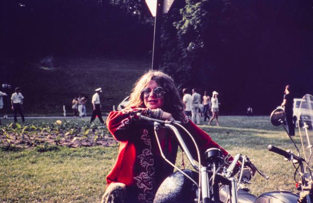 crockpics's tweet photo. Janis Joplin astride a custom chopper in Columbus, Ohio, June 1970. A great color portrait captured by her road manager and photographer John Byrne Cooke during her final summer tour with the Full Tilt Boogie Band. What is your favorite Janis Joplin song? https://t.co/6Gdb2lv1yc