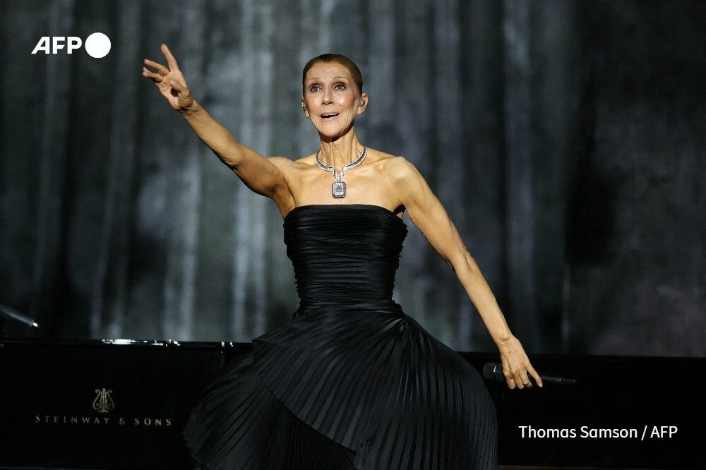 AFP's tweet photo. Celine Dion fulfills her dream of returning to the stage after years battling a rare neurological disorder with a sell-out concert Saturday in an arena west of Paris. https://t.co/0Sx2IWOxT7 https://t.co/mUUf8f9fY6