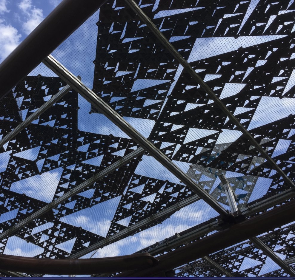 YoheiNishitsuji's tweet photo. A Sierpinski tetrahedron looks triangular from most angles, square from a few. Fractal sunshades in Japan use this to balance shade and airflow as the sun moves. Do you have something like this where you live? https://t.co/SP8ZhbBwnm