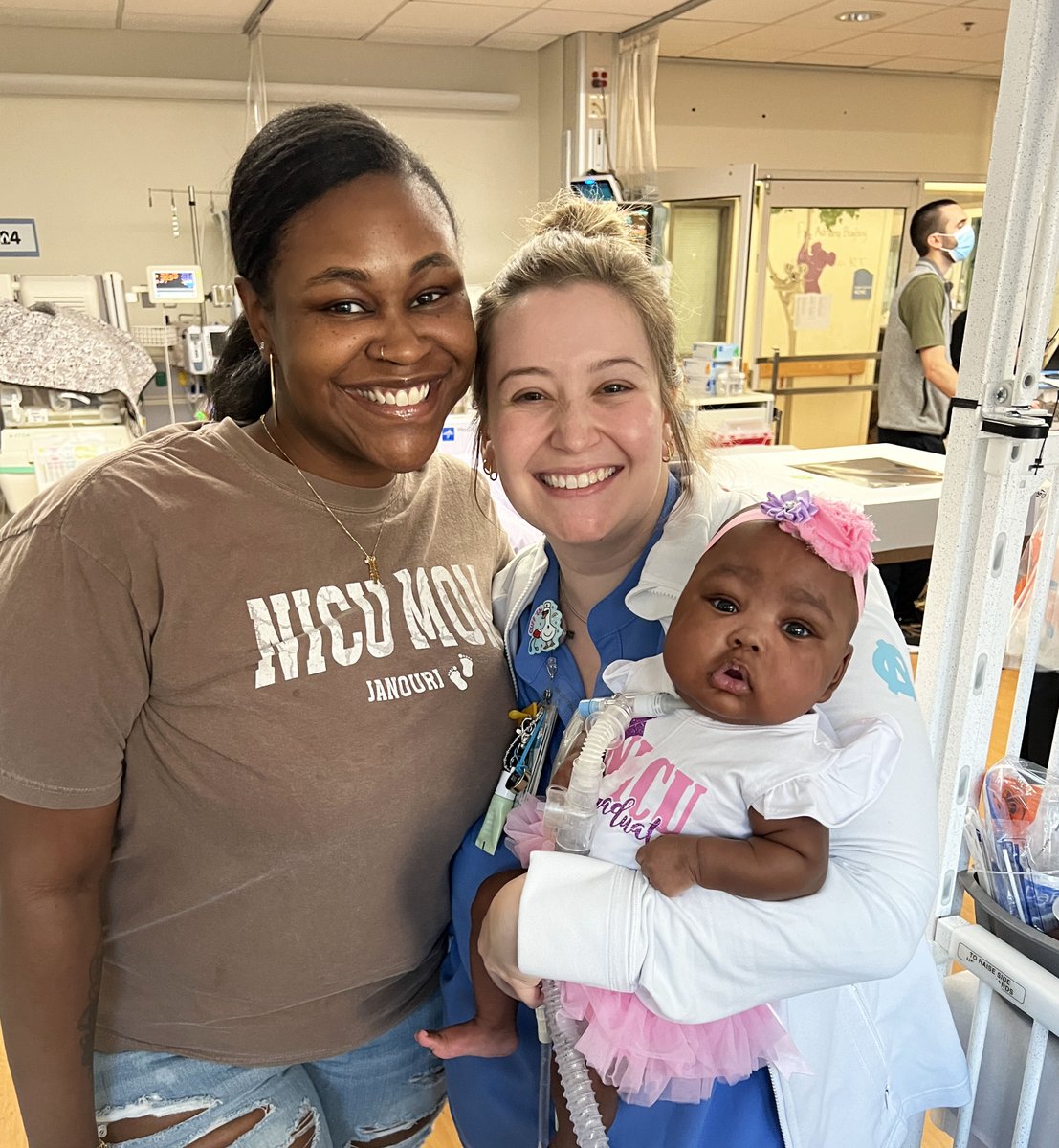 uncchildrens's tweet photo. A very special graduation at UNC Children's Hospital. 💗 

After seven months of NICU care, baby Janouri is headed home! Our teammates and her family came together to celebrate with cupcakes, a pink graduation cap and a special song. https://t.co/kA5HOskQsg