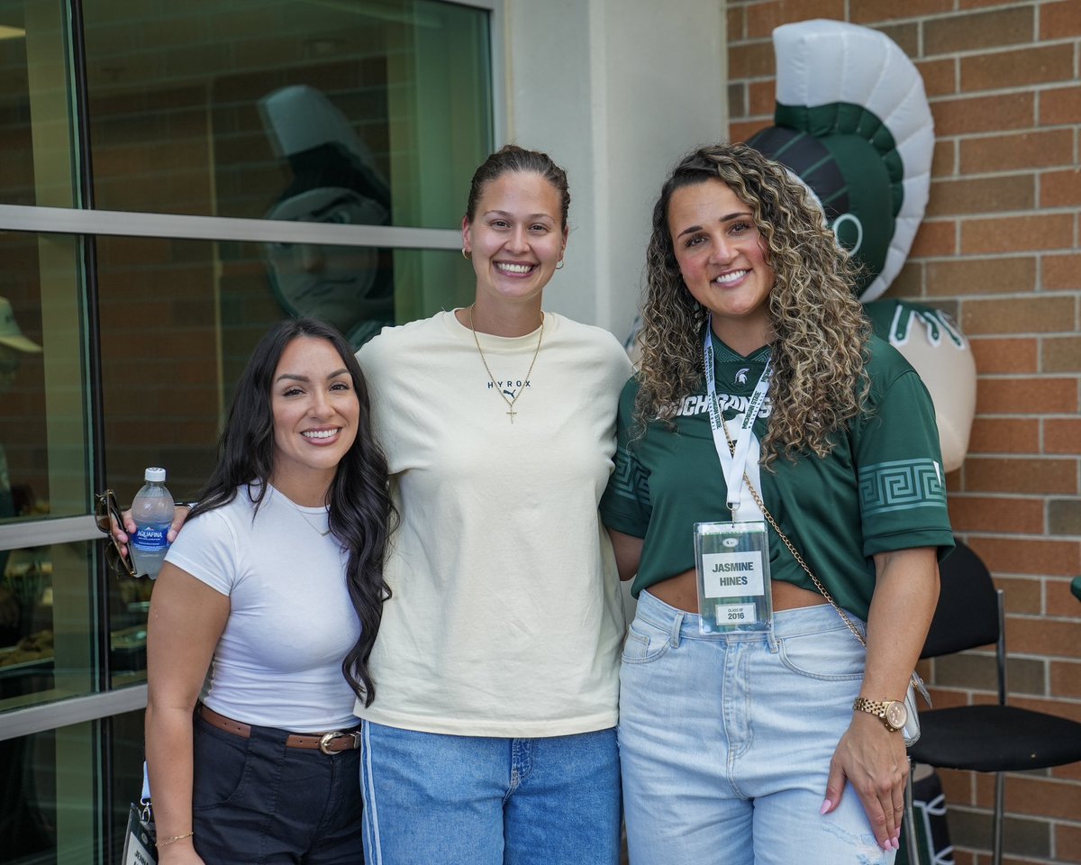 Spartan alum posing at the tailgate