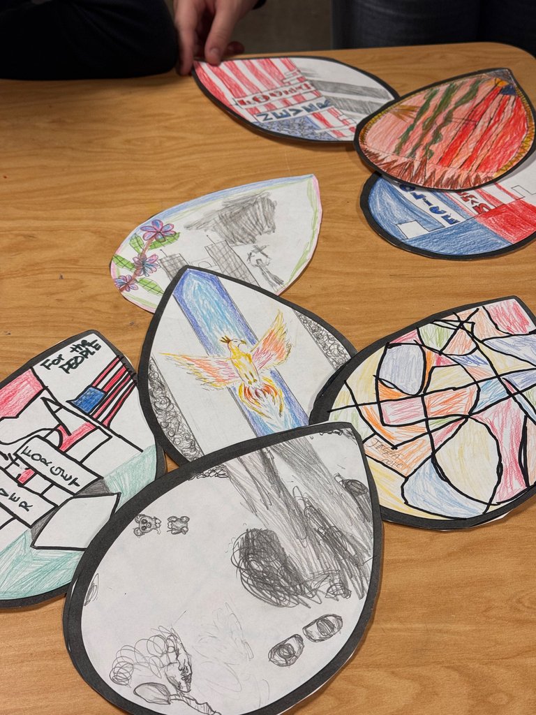 CMSGoBlue's tweet photo. Yesterday, many of our classes had lessons and projects that gave them time to reflect on the events of 9/11.  Students in Mrs. Sigmon's classes created art with the "Feathers of the Phoenix" lesson from the 911 Memorial focusing on hope, resilience, and unity. https://t.co/KICxM5l2xr