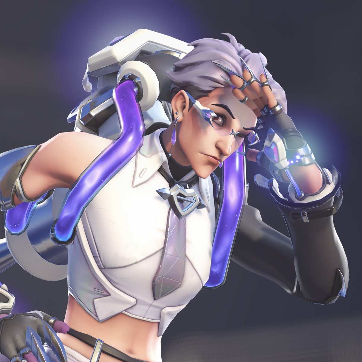 bioticgasp's tweet photo. I love Moira’s Le Sserafim skin as it indulges my affection for handsome women in STEM living their lives under scrutiny for controversial experimentation genuinely enjoying themselves and their interests with unapologetic delight. (And the tie + tummy combo of course. 😻) https://t.co/YjRupG2SMP