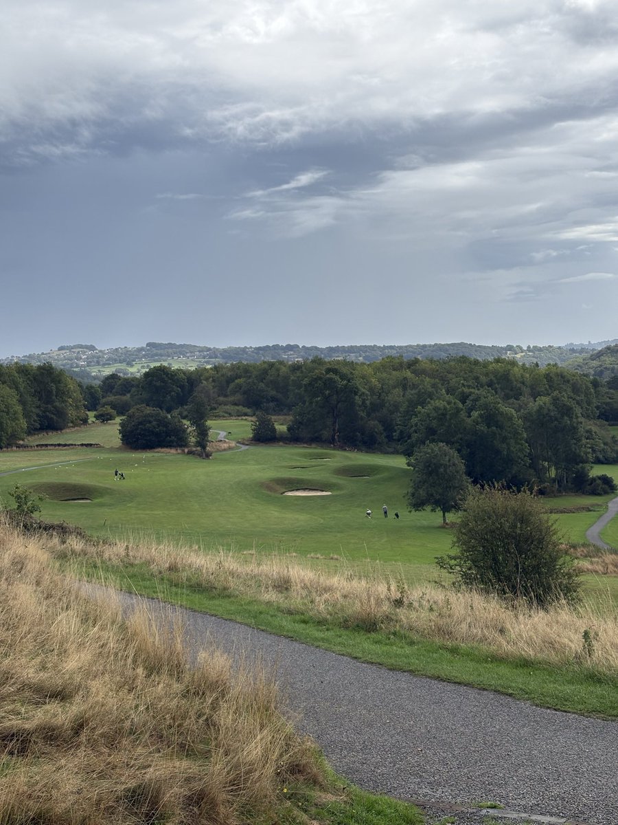 TheYorkshireTee's tweet photo. Hollins Hall Golf Course Review⛳️

With rounds available for around £30 on a Sunday morning through GolfNow, Hollins Hall is a charming course offering amazing views across the Yorkshire countryside, including a great view of Baildon, another course I’ve previously reviewed.

It seems every time we play Hollins Hall, the elements are against us, with either torrential rain or heavy wind causing some inconvenience. However, a sign of a good course is one that remains thoroughly enjoyable despite the weather - and Hollins Hall certainly does.

One small addition that never gets old is the cart service up to the first tee. The walk up there will get the heart rate going and have you feeling tired before you’ve even teed off!

The course has a great mixture of forgiving par 4s and short par 3s, alongside longer par 4s and 5s that require strategy and different clubs off the tee.

Standout Holes

This was a tricky section to choose, as Hollins Hall has a number of standout holes. Overall, I think the back 9 is stronger than the front.

Hole 6 - A downhill par 4 shaped by the tree lines, requiring an accurate tee shot. With the green guarded by a small water hazard short left, a short iron into the green gives you a great chance of making a good score.

Hole 9 - One of the most interesting golf holes I’ve ever played, and I don’t think the camera does it justice. A 220-yard shot is required off the tee, before a steep drop down towards the green. Any wayward shots can quickly disappear into the trees.

Hole 13 - Another hole shaped by the landscape, offering an interesting test as a 160-yard par 3 straight down the hill. Picking the right club is a challenge, although coming up short allows the ball to roll down towards the front of the green.

Hole 14 - One of my favourite golf holes in all of Yorkshire. A proper risk-and-reward hole with the viaduct as a backdrop.

You can either try to drive the green, risking a lost ball left or dribbling into the water on the right, or lay up short of the hazards. Even then, an accurate shot is required to avoid the bunkers and brook running through the hole.

Verdict

Whilst I didn’t make use of it on this visit, Hollins Hall also has an 11-bay TrackMan range. Near the first tee there’s also a practice green and some nets to warm up.

The greens and tee boxes had recently been seeded, so unfortunately the course wasn’t in prime condition on this visit. That’s not a criticism of the course itself, and on previous visits it has always been in very good condition.

The halfway-house sausage sandwich also wasn’t my favourite… 🌭😂

However, Hollins Hall once again provides some of the best value for money in Yorkshire, combining great views, varied holes and a great pint in the clubhouse afterwards.

Overall, I’d have Hollins Hall on par with Baildon.

Yorkshire Tee Rating: 8.5/10 

#golf #golfcoursereview #YorkshireGolf
