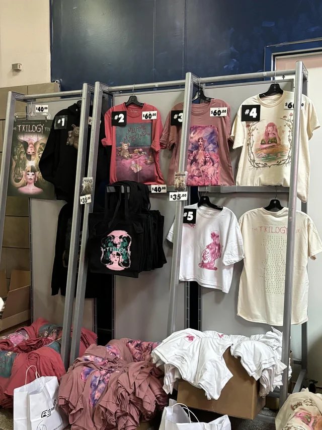 MelanieExposing's tweet photo. 11.Scamming her fans 
melanie martinez makes her merchandise OVERPRICED, she constantly scams her fans, then she claims that she’s “broke” and that shes in “debt”, like girl be serious, you bought over 3 mansions. https://t.co/UFOAOjmd2N