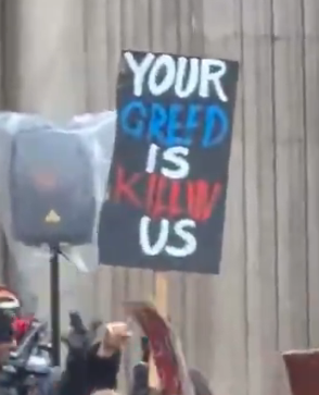 TheBatmanFilm_'s tweet photo. Multiple protest signs have been spotted on the set of ‘THE BATMAN 2’ 🦇

• “Court of Fowls”
• “I'm coming for you next”
• “Your Greed is Killing Us”
• “Oligarchs gotta go”
• “The richer get richer”
• “Eat the rich”
• “One day the poor will have nothing”
• “Gotham is _____ for justice”
• “Re$i$t”