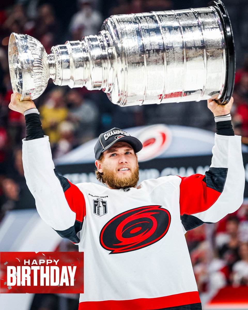 Photo of Mark Jankowski hoisting the Stanley Cup on the ice after winning