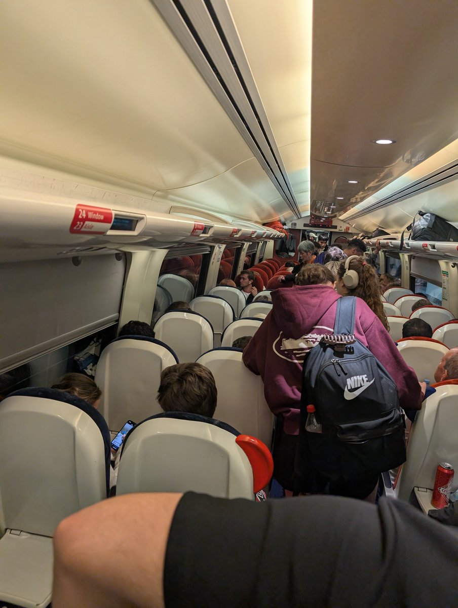 jackneill01's tweet photo. @CrossCountryUK is there a reason no one has replied to the complaint I made to you over a month ago, and that now this is the state of your current train to Reading (I cannot reach the seat I've paid for, which someone else is sat in). https://t.co/q8BqpbHoW1