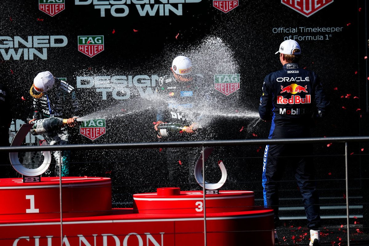 wisterianorr1s's tweet photo. max and kimi rushed to spray lando in the podium 😞 

the legitimate winner https://t.co/J14WywQM5N