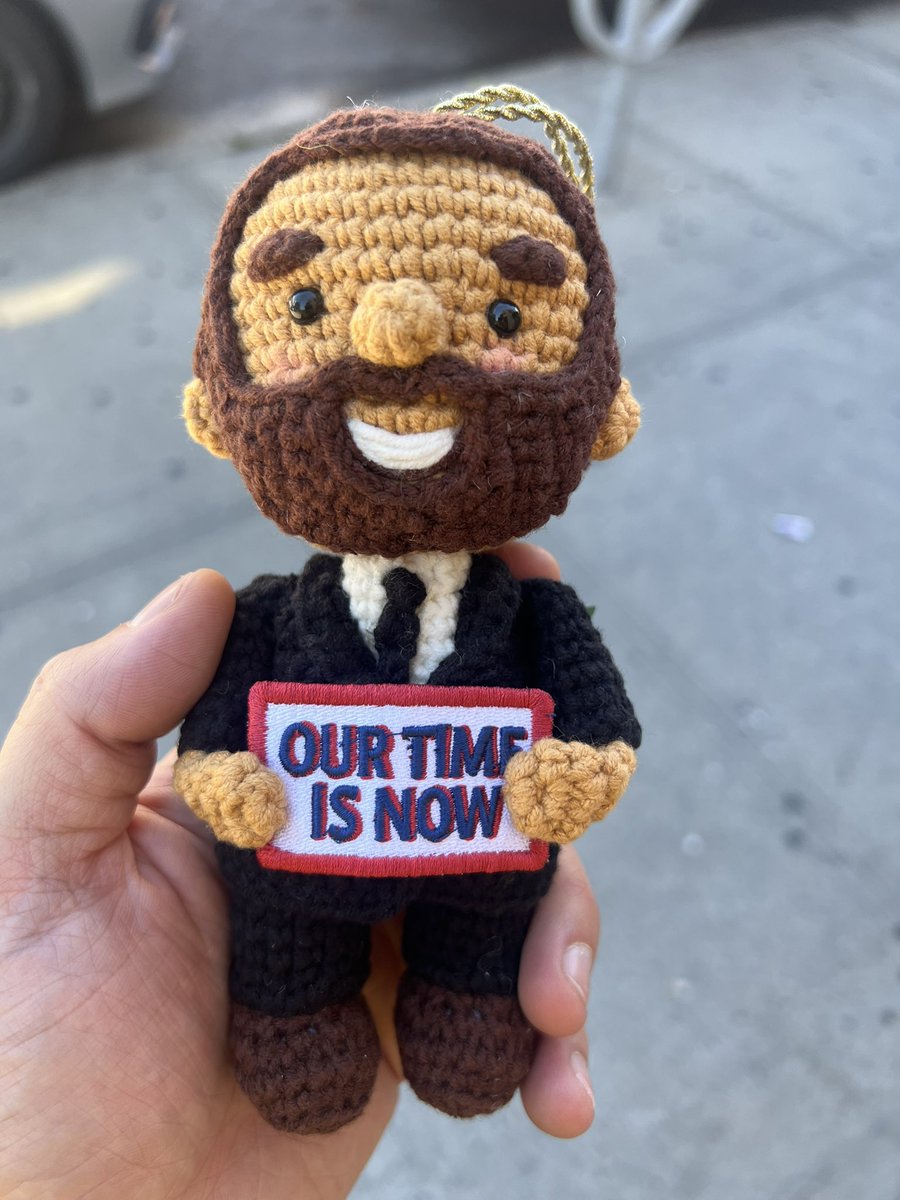 ComradeCliff's tweet photo. Moved to Astoria this morning and a kid on the street already sold me a knitted zohran his mom designed https://t.co/oa0KpcBDVa