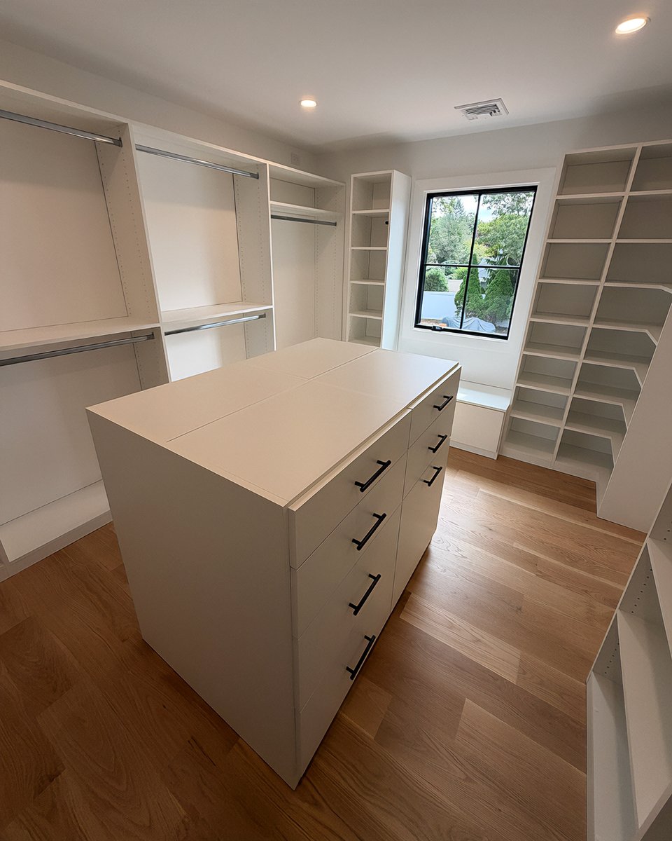 ClosetDesignLI's tweet photo. Clean, bright, &amp; fully organized! 🛠️ Check out this custom white walk-in closet with a center island and window bench we just completed in Commack, NY.

To learn more visit our website at https://t.co/yXXK6Mnghe

#Commack #CustomClosets https://t.co/jble44sEhh