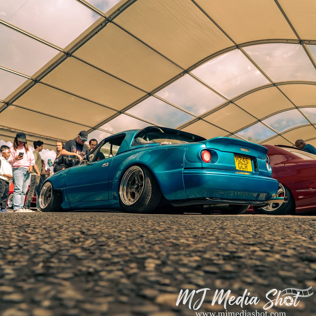 SpringColtby's tweet photo. Small car. Big boost. Turbocharged, slammed Mazda MX-5 Miata making a serious statement at GOjapan 2026. Low stance. Boosted power. Pure JDM attitude. You don’t need a big car to make a big impression. https://t.co/FlpY5BjQDp