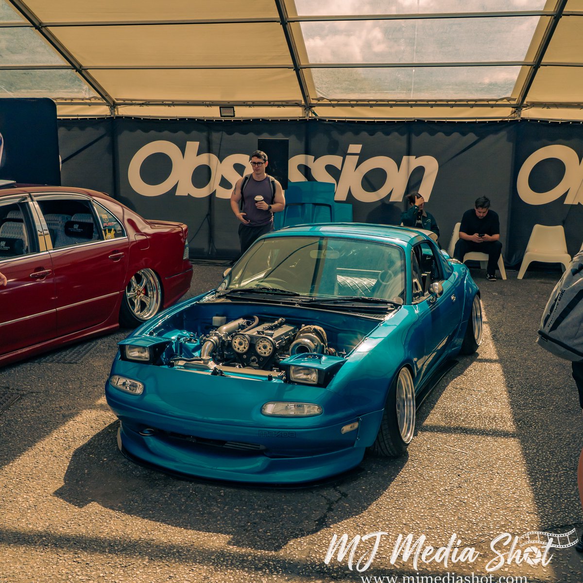 SpringColtby's tweet photo. Small car. Big boost. Turbocharged, slammed Mazda MX-5 Miata making a serious statement at GOjapan 2026. Low stance. Boosted power. Pure JDM attitude. You don’t need a big car to make a big impression. https://t.co/FlpY5BjQDp