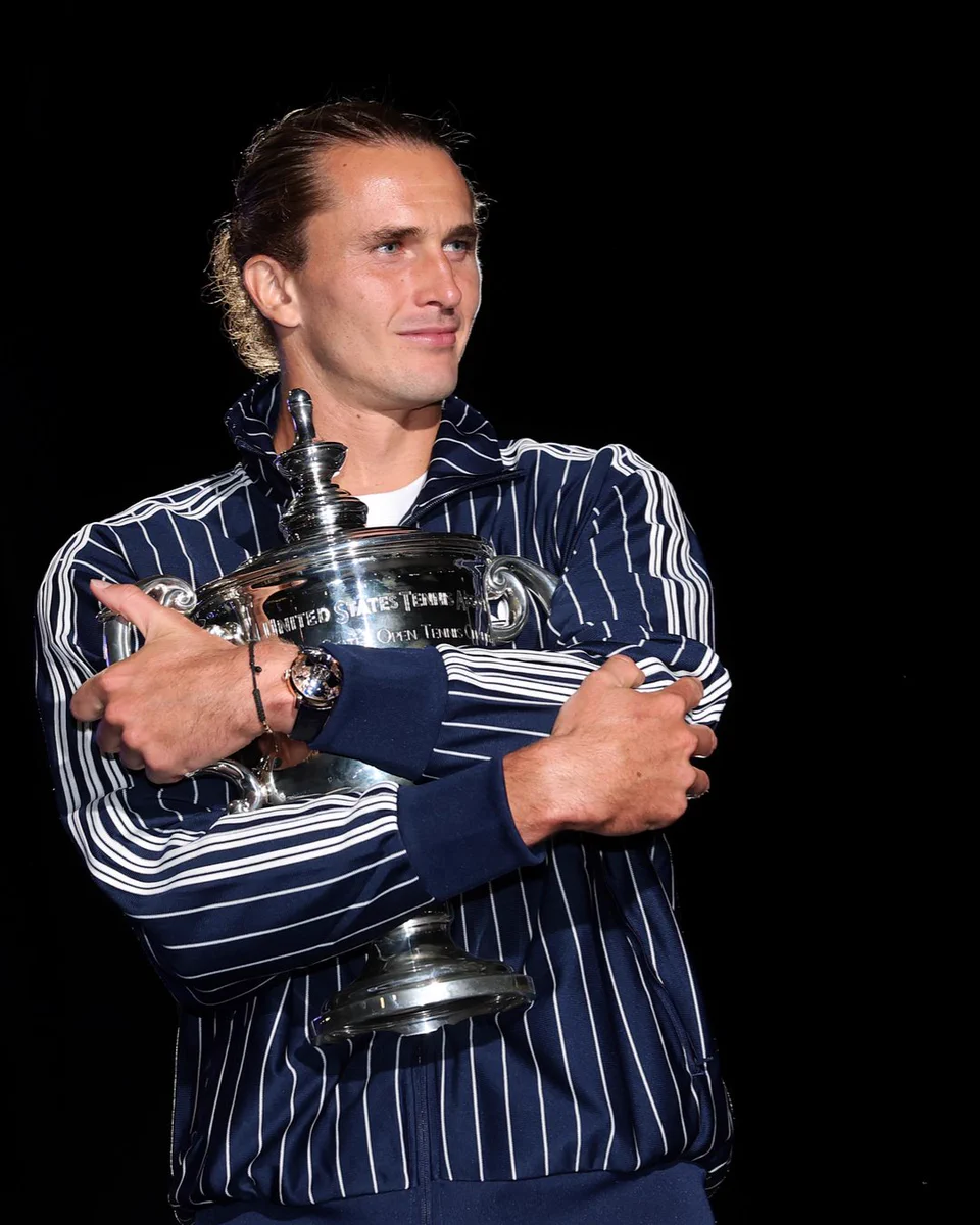 Alexander Zverev poses with the trophy following the US Open men's singles final