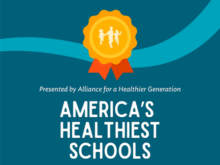 Gold medal emblem with children figures above the text 'America's Healthiest Schools' presented by Alliance for a Healthier Generation.
