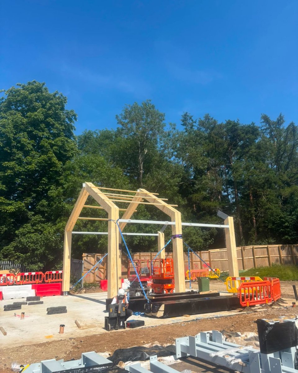BucklandTimber's tweet photo. Bookham Youth &amp; Community Centre taking shape - Spruce GL28 #glulam frame working alongside the steel framing system, is now in place. Proud to have manufactured and installed the #glulam as part of the wider project team. Beard_Construct #HPWArchitecture #AWAConsultingEngineers https://t.co/fb2HpvUpu6