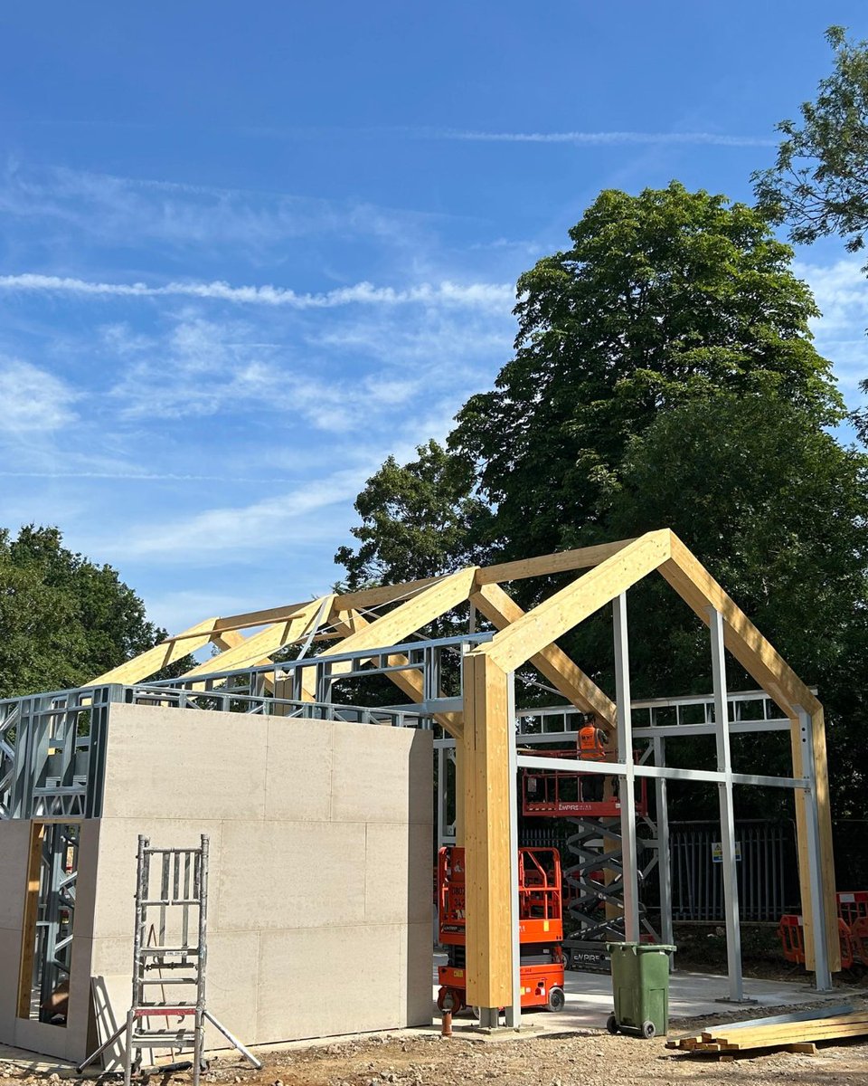 BucklandTimber's tweet photo. Bookham Youth &amp; Community Centre taking shape - Spruce GL28 #glulam frame working alongside the steel framing system, is now in place. Proud to have manufactured and installed the #glulam as part of the wider project team. Beard_Construct #HPWArchitecture #AWAConsultingEngineers https://t.co/fb2HpvUpu6