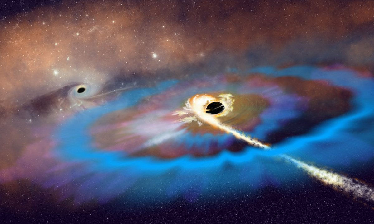 Artist’s interpretation of two massive black holes (MBHs) within a galaxy. A tidal disruption event unfolds around the MBH that resides away from the galactic center and matter from a disrupted star swirls into a bright accretion disk, launching an energetic outflow and resulting in two bright radio flares. Credit: NSF/AUI/NSF NRAO/P.Vosteen