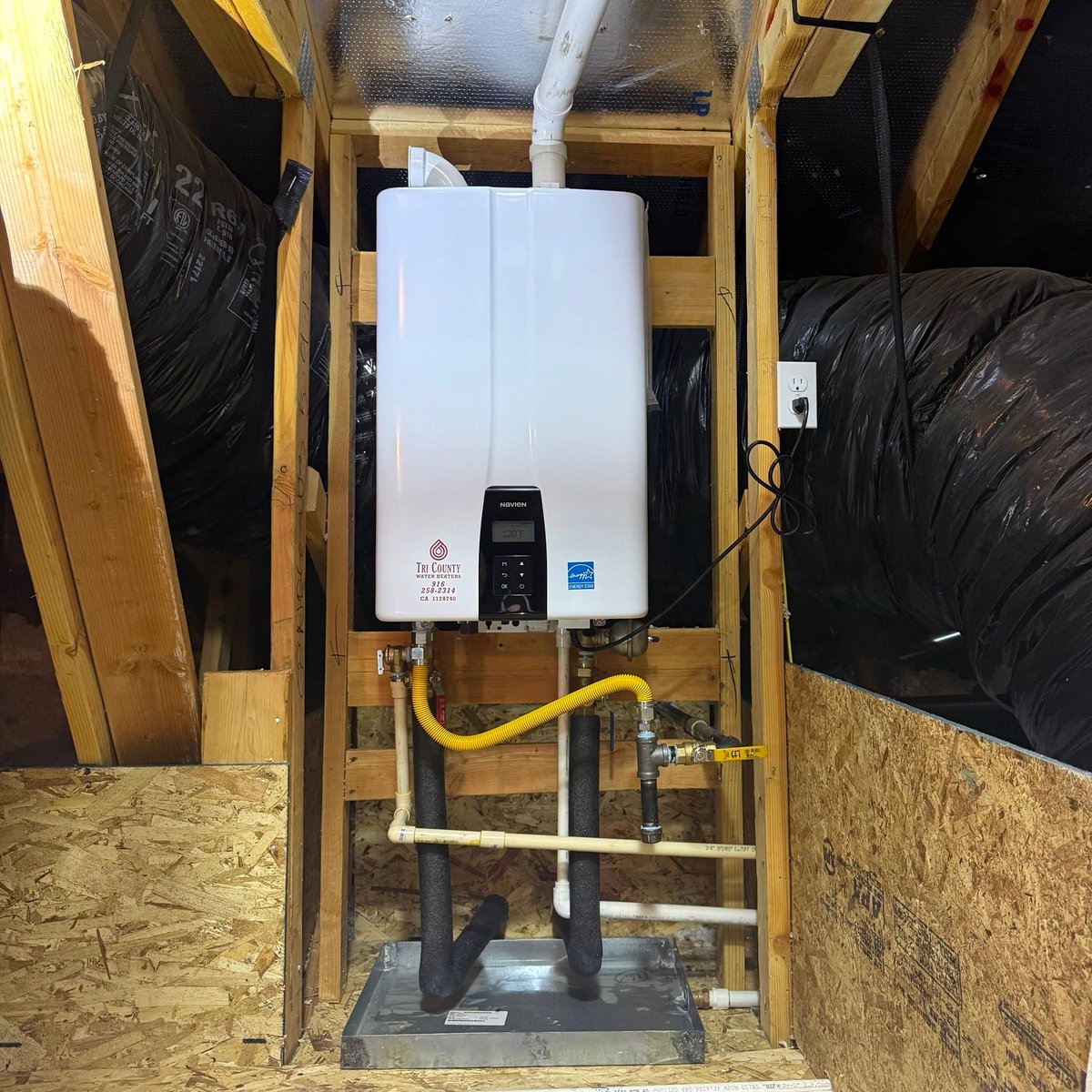 TCWaterHeaters's tweet photo. Nice tight attic installation. Glad we got this one done early because it was a pretty hot day here! #TCWH #TriCountyWaterHeaters 
#waterheater #tanklesswaterheater #navien https://t.co/AmXku262WC
