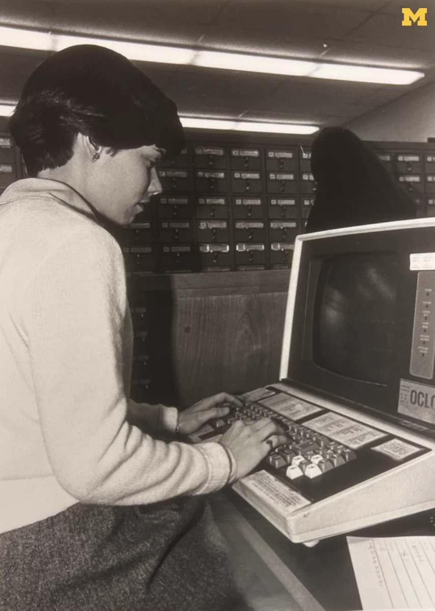 A student uses a terminal for an online cataloging system. Photo courtesy of the Bentley Historical Library