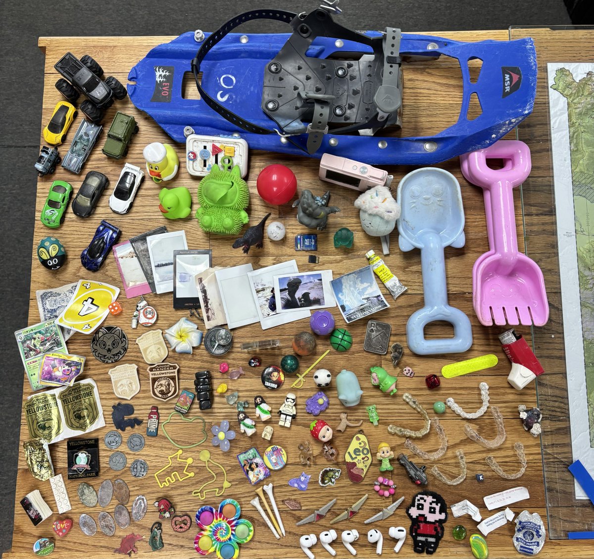 USGSVolcanoes's tweet photo. Hold onto your hats and sunglasses—and your trash! Today's Yellowstone Caldera Chronicles details the items that Yellowstone National Park’s Geology team has collected so far this season from the park’s hydrothermal areas. There are some pretty interesting finds...

https://t.co/qDj3CdVK8z

📷1: Hats collected by the Yellowstone National Park Geology Team and other park staff from hydrothermal areas during the summer 2026 season (Geology Team truck for scale).

📷2: Coins, bills, and jewelry collected by the Yellowstone National Park Geology Team from hydrothermal areas during the summer season in 2026.

📷3: Frequent finds collected by the Yellowstone National Park Geology Team from hydrothermal areas during the summer season in 2026: camera lens covers and binocular parts, pens and pencils, sunglasses, hair accessories, hotel keys, and more!

📷4: More bizarre Yellowstone National Park Geology Team finds from hydrothermal areas during the 2026 summer season—including golf tees, fortune cookie fortunes, AirPods, rubber ducks, and Invisalign retainers!

All photos by Margery Price, Yellowstone National Park, September 2026.