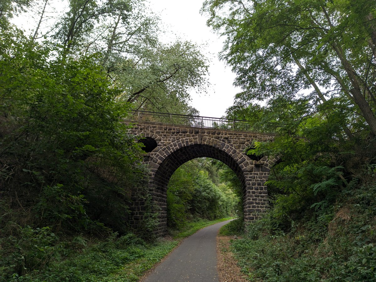 PascalHeyman's tweet photo. 🚴 🌤 ☁ along the Maifeld-Radweg, a stretch of a disused railway track between Koblenz, Mayen and Münstermaifeld in the Eifel 🇩🇪. A pleasant route featuring railway tunnels, bridges, viaducts and views on ancient vulcanos. Info here: https://t.co/BpZjTLzMu2 https://t.co/4cuUecxaT6