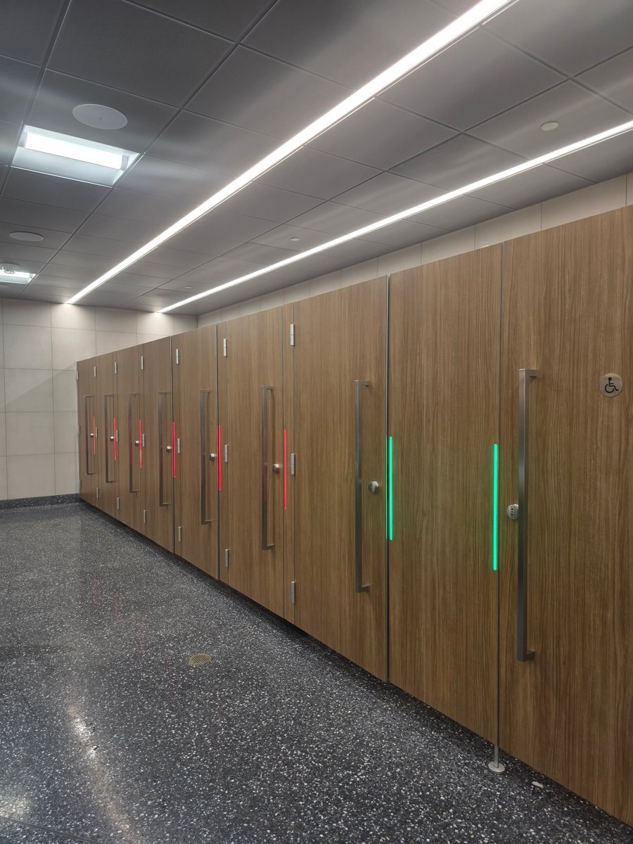 OnlyInBOS's tweet photo. Logan Airport’s new bathrooms have a feature travelers will appreciate.

Bathroom stalls now have lights showing whether they’re available.

🟢 Green = vacant
🔴 Red = occupied https://t.co/3WqYf9MYUO