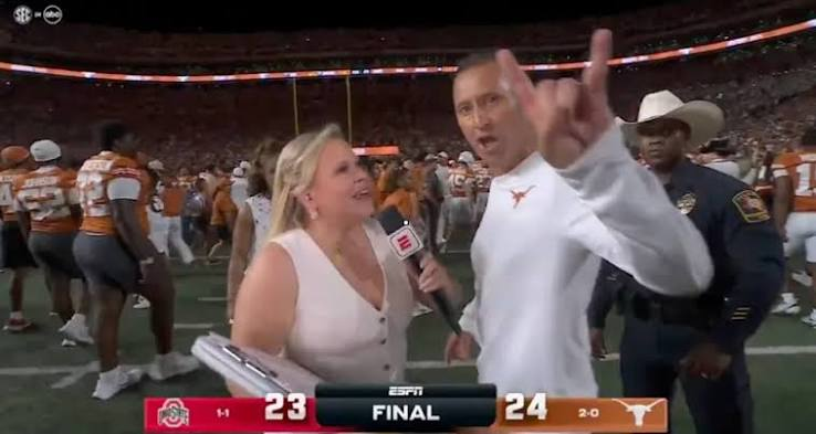 mattlawson99's tweet photo. I've been on a lot of sidelines, even served as a sideline reporter a couple of times. Here's my take on everyone's favorite story today. 
1) Context matters. They made Sark wait for MINUTES due to technical issues at half and he really needed to get into the locker room. Apparently there were more issues postgame while he was waiting to celebrate with his team. It's extremely reasonable that he may have been worrying about missing that special time.
2) That being said, it only takes 7 seconds to say, "Man, I'm so proud of these guys, Holly. That's true Texas Fight right there to never give up. But I'm sorry - I gotta' get in there with my guys. Hook 'Em!" That would have been more professional.
3) Holly Rowe is ALSO a professional. And one who isn't nearly as invested emotionally. She could have turned to the camera after he ran off with, "Well, guys, there goes one happy coach who can't wait to be with his team. We'll see if we can grab someone else, but this place is understandably in celebration mode." Instead, she chose to sulk on-air and make it into more than it is.
4) And most importantly, it's just a postgame interview. This isn't, and never was, an actual big deal. Maybe he gets fined, but with the context of technical issues, I bet he won't. Either way, that should be the end of it. Nothing to see here. Move along.
Thank you for coming to my TED Talk. 🤘